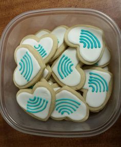 a plastic container filled with heart shaped cookies