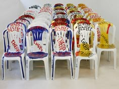 a bunch of chairs that have been painted to look like they are made out of plastic