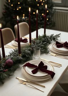 As the holiday season approaches, nothing brings the Christmas spirit to life like a beautifully decorated table. Whether you're hosting an intimate family dinner or a grand holiday party, your Christmas table decor is key to setting the tone for the celebration. From timeless red and green schemes to modern metallics, there are countless ways to create a magical and welcoming space. Aesthetic Christmas Dinner Table, Winter Birthday Table Decor, Dark Green Christmas Table Decor, Christmas Party Table Settings Ideas, Christmas Hosting Table, Christmas Dinner Round Table Settings, Christmas Dinner Table Set Up, Crismas Ideas Decoration Home, Chic Christmas Table Decor