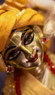 a close up of a person wearing a mask