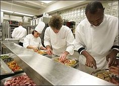 four chefs preparing food in a kitchen with the caption do you ever buy school lunch or eat at a restaurant? food is a good