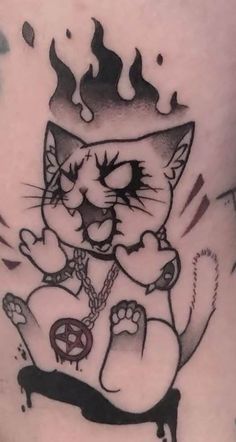 a black and white photo of a cat tattoo