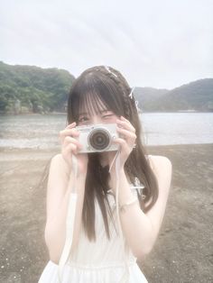 a woman taking a photo with her camera