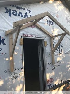 a house under construction with the door open