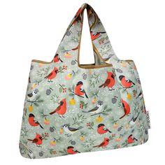 a bag with birds on it and pine cones around the handles, hanging from a hook