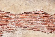 an old brick wall that has been torn down and is being used as a background