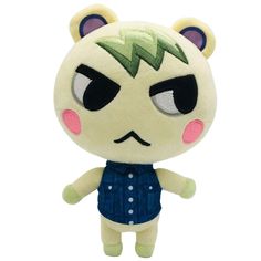 a small stuffed animal with big eyes and green hair on it's head, wearing a