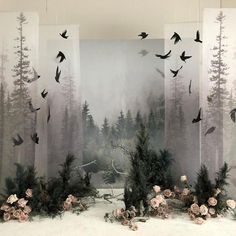 an image of a forest scene with birds flying in the sky and flowers on the ground