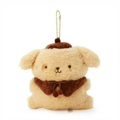 a small stuffed animal with a scarf on it's neck is hanging from a chain