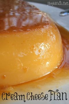 a close up of a dessert on a plate with caramel sauce and spoons