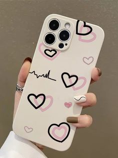 someone holding up their phone case with hearts on it