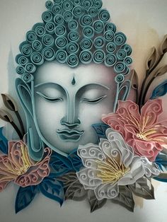 an intricately designed buddha face surrounded by flowers