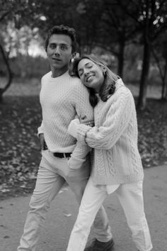 black and white photograph of two people in the park, one holding his arm around the other