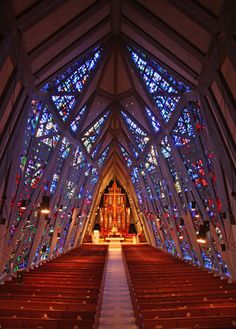 the inside of a church with stained glass windows