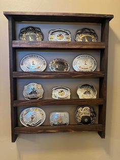 a wooden shelf with many plates on it