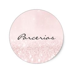 a round sticker with the word barcelona in black ink on pink and white glitter