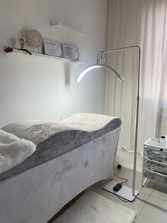 a bed with a lamp on top of it