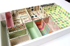 an open drawer with many different patterns and colors on the drawers, including polka dots