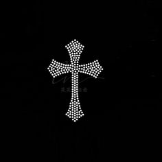 a cross made up of small white dots on a black background with the word jesus written below it