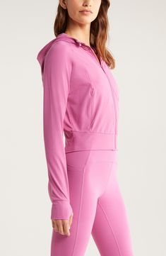 Whether you're running, hiking or hitting up the yoga studio, this raglan zip hoodie made with plenty of easy-moving stretch offers ultimate comfort and style. 21" length (size medium) Front zip closure Fixed hood Thumbhole cuffs Front zip pockets 74% nylon, 26% spandex Machine wash, tumble dry Imported Stretch Athleisure Outerwear For Loungewear, Stretch Outerwear For Loungewear In Athleisure Style, Hooded Activewear With Drawstring Hood For Workout, Hooded Activewear With Drawstring For Running, Workout Activewear With Drawstring Hood, Stretch Hooded Hoodie For Running, Hooded Activewear For Running In Fall, Athleisure Running Hoodie With Drawstring Hood, Pink Athleisure Activewear With Ribbed Cuffs