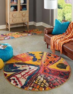 a living room filled with furniture and colorful rugs