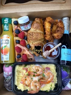 a box filled with different types of food and condiments on top of it