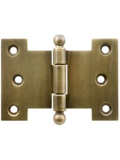 an antique brass door hinge with three holes