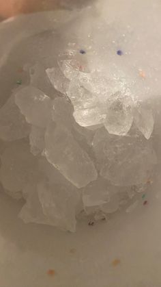 some ice and sprinkles in a white bowl