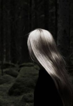 the back of a woman's head with white hair