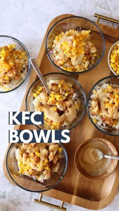 four bowls filled with different types of food on top of a wooden tray and the words kfc bowls above them