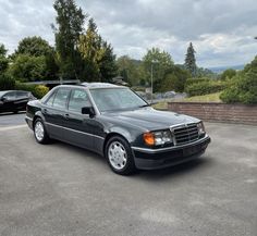 a mercedes benz parked in a parking lot