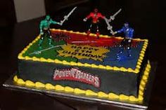 a cake decorated with the characters of spider - man and green lantern on top of it