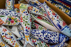 colorful ceramic fish and spoons in a box