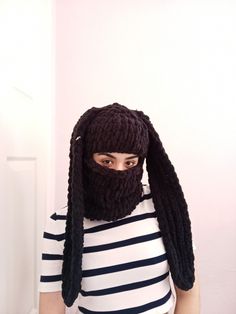 a person wearing a knitted hat and beard