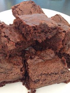 brownies stacked on top of each other on a plate