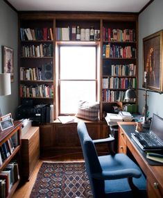 a home office with bookshelves full of books