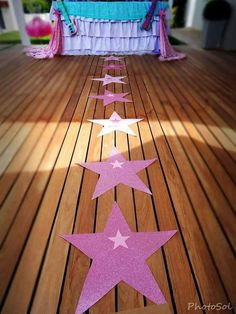 pink and white stars are painted on the floor