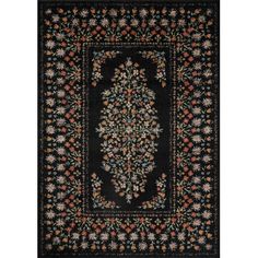 a black rug with an ornate design on the center and bottom, surrounded by flowers