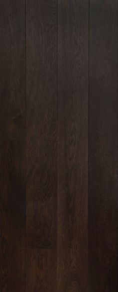 a black door with wood paneling on the side and bottom part in dark brown