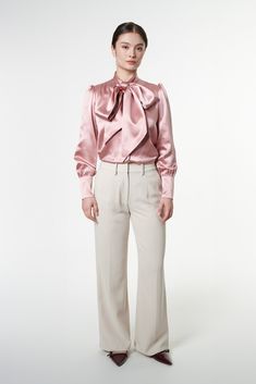 Our Kathrine Ribbon Blouse captures attention with its signature oversized front bow, instantly recognizable as a symbol of timeless elegance. Crafted from luxurious silk, this blouse exudes modern-day romance and feminine charm, standing out as a characterful piece that elevates any ensemble. Inspired by a dear British friend, it seamlessly combines grace with individuality, evoking a sense of enchantment. It's more than just a blouse; it's a statement of Daeira's unique essence. Picture yourself draped in its beauty, exploring the pages of a captivating book within the walls of a historical library. 100% 6A Grade Mulberry Silk Dry clean only Low heat iron Historical Library, Captivating Book, Ribbon Blouse, Shirt Blouses Women's, September Birthstone Jewelry, Gifts For New Mums, Pearl Jewellery Earrings, Silk Ribbon, Fashion Jewellery