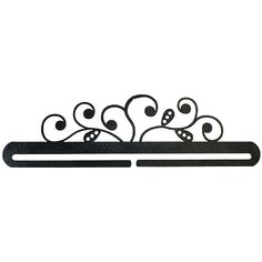 a black metal shelf with decorative designs on the top and bottom, against a white background