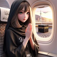 a woman is sitting on an airplane looking out the window at the ka'bah