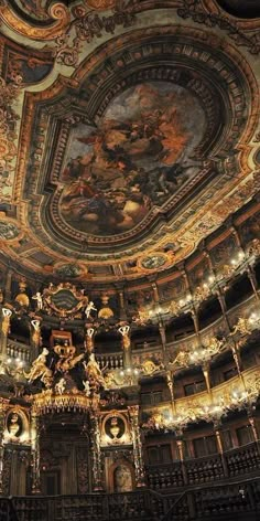 an ornately decorated room with chandeliers and paintings on the ceiling