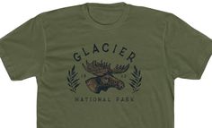 This retro Glacier National Park cotton crew tee is the perfect addition for your next outdoor adventure. The premium fitted short sleeve shirt is lightweight, soft, and comfortable. PRODUCT DETAILS * Style: Next Level 3600 * Material: 100% Cotton * Color: Army Green * Tear-away label DETAILS * This product is made to order, and as a result, all sales are final. We don't accept returns & exchanges. * Customizations are not offered on this product. * This product may not be reproduced or resold c Green Retro, Glacier National, Glacier National Park, T Shirt For Men, Outdoor Adventure, Workout Shorts, Moose, Army Green, San Jose