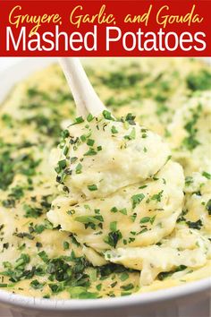 mashed potatoes in a white bowl with a wooden spoon and text overlay that reads gruyre garlic and goula mashed potatoes