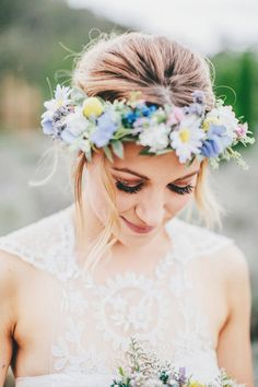 a woman wearing a flower crown on her head