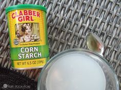 a jar of corn starch next to a can of crabber girl seasoning