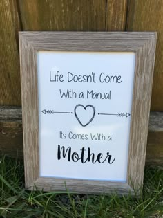 a sign that says life doesn't come with a manual, it comes with a mother