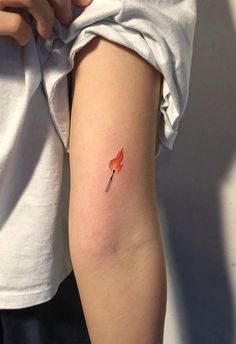 a person with a small tattoo on their arm