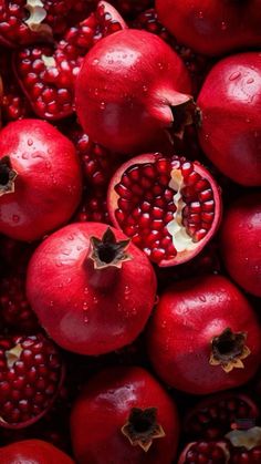 pomegranates are shown with water droplets on them